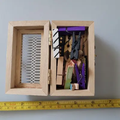 Small Wooden Storage Box with Decorative Clothespins photo 1