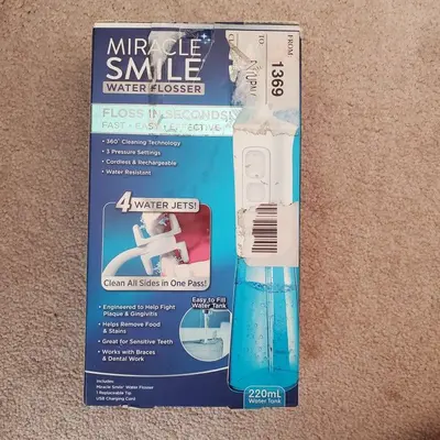 Miracle Smile Cordless Water Flosser with H-Shaped Head and 4 Jets photo 1