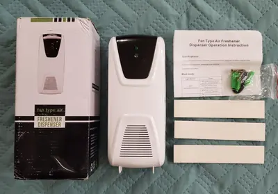 Automatic Fan-Type Light-Sensor Air Freshener Dispenser photo 2