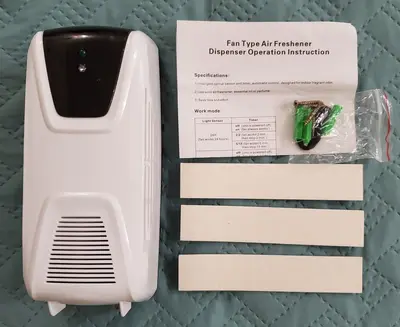 Automatic Fan-Type Light-Sensor Air Freshener Dispenser photo 1